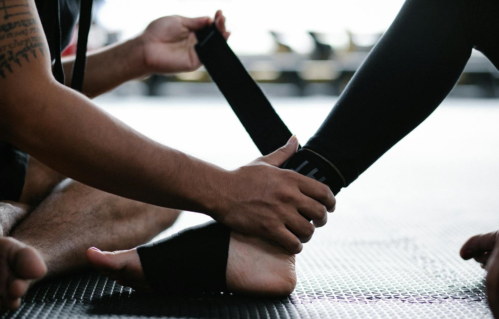 person wrapping leg in elastic bandage